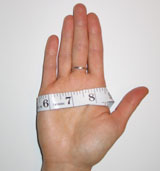 Open Hand With Tape Measure