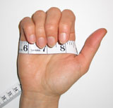 Closed Hand With Tape Measure